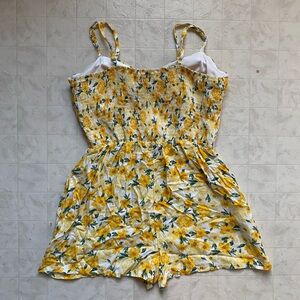 Yellow floral romper, with padding and pockets